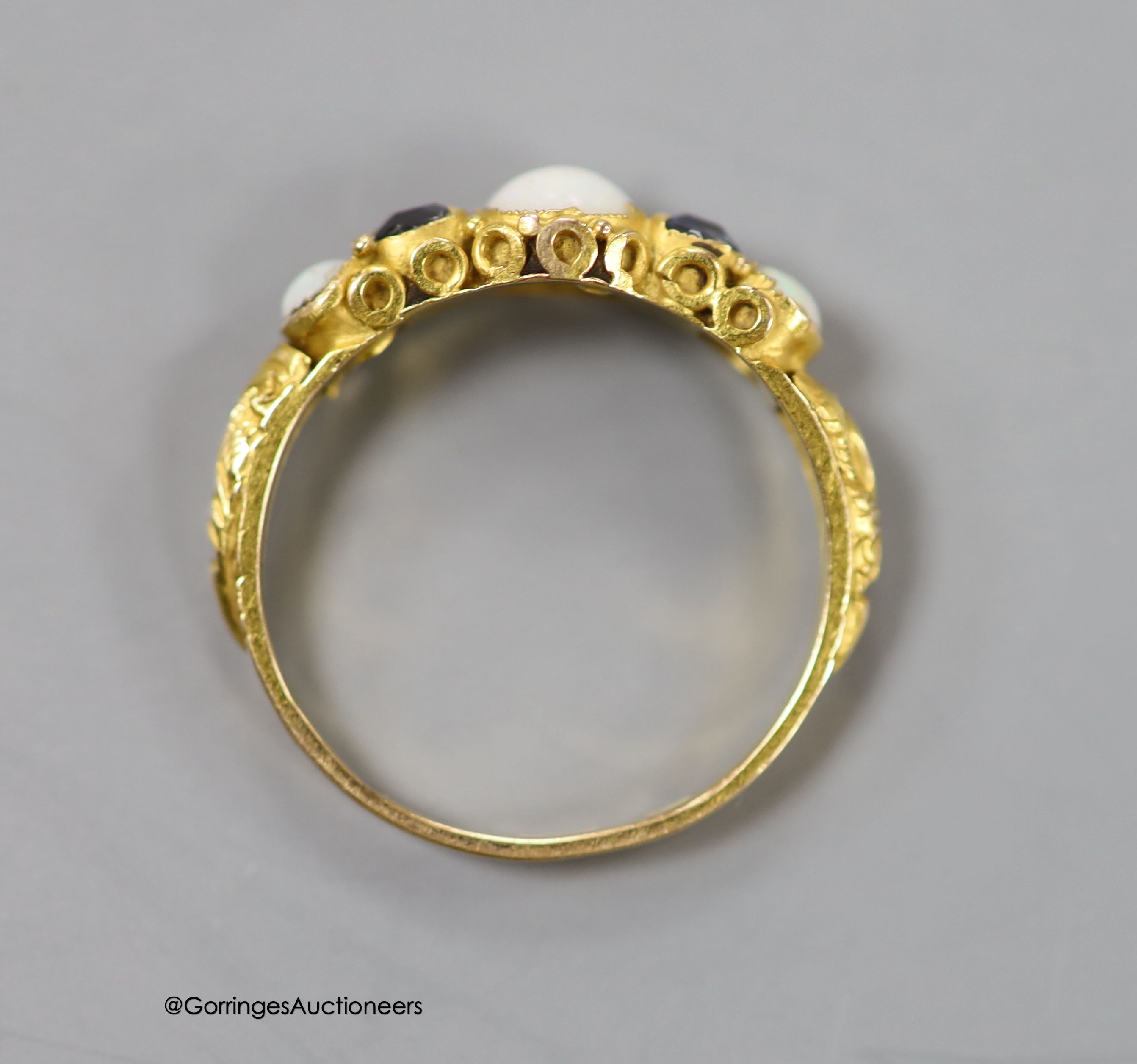 A Victorian 15ct gold, three stone white opal and two stone sapphire set half hoop ring, size L/M, gross 1.4 grams.